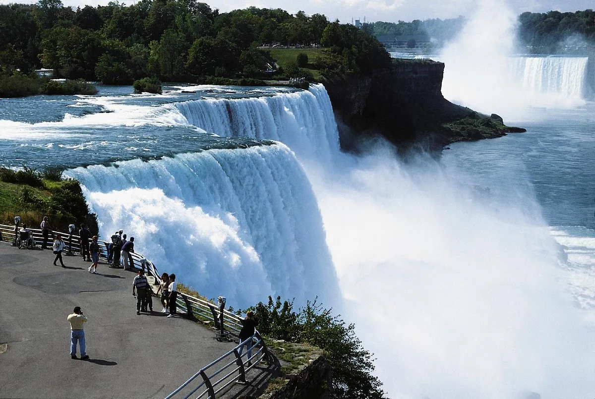 A tour boat pushing into the mist at the base of the Niagara Falls