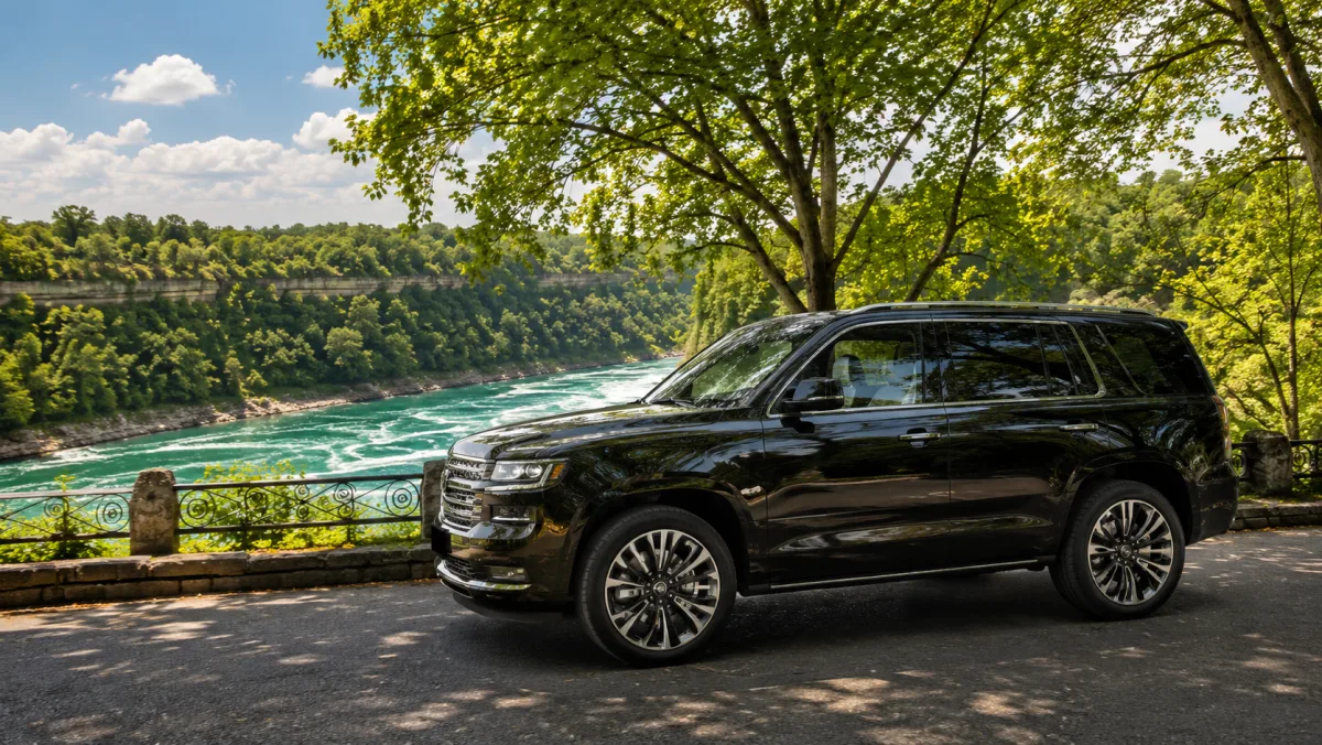 Black full-size luxury SUV with chauffeur — private Niagara Falls tour for families